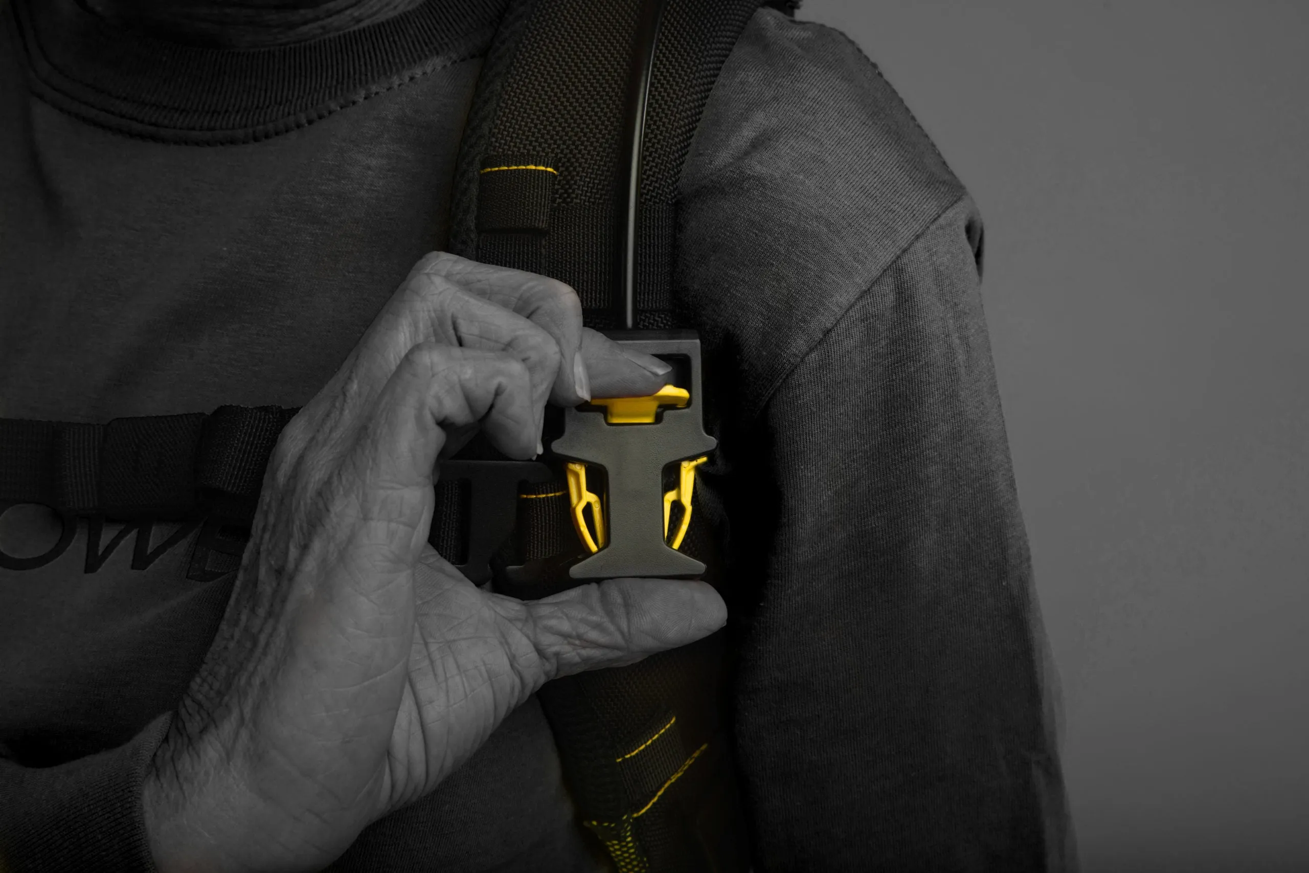A worker’s hand on the Apex 2 chest clutch